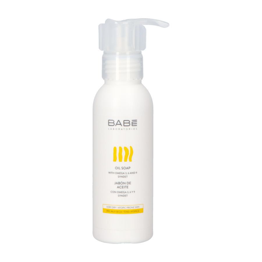Flacon blanc avec pompe. Inscription BABE, design jaune et texte: OIL SOAP.