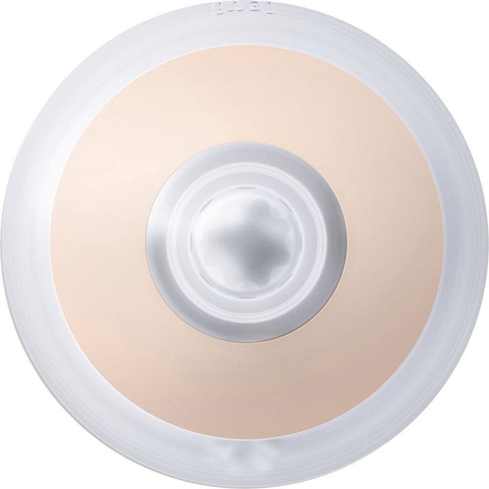 Vue de dessus d'une tétine. Base rose, embout transparent.