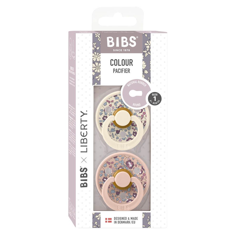 BIBS Liberty Eloise Blush Duo. Boîte avec deux sucettes. Fenêtre montrant deux sucettes à motifs floraux.
