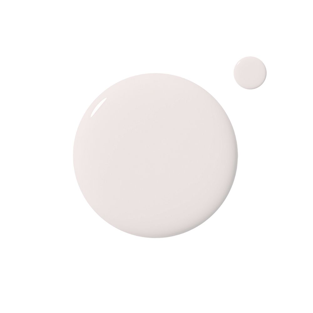 Vernis à ongles blanc sur fond blanc. Un grand cercle et un petit cercle.