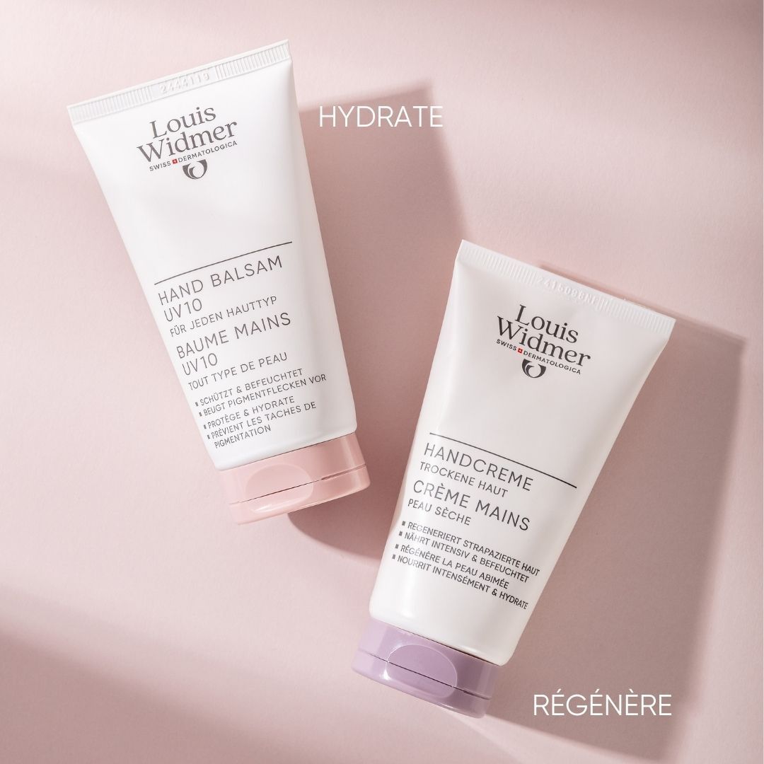 Deux tubes de crème pour les mains et baume pour les mains Louis Widmer. Blanc, bouchons violets et roses. Inscription : Handcreme, Handbalsam.