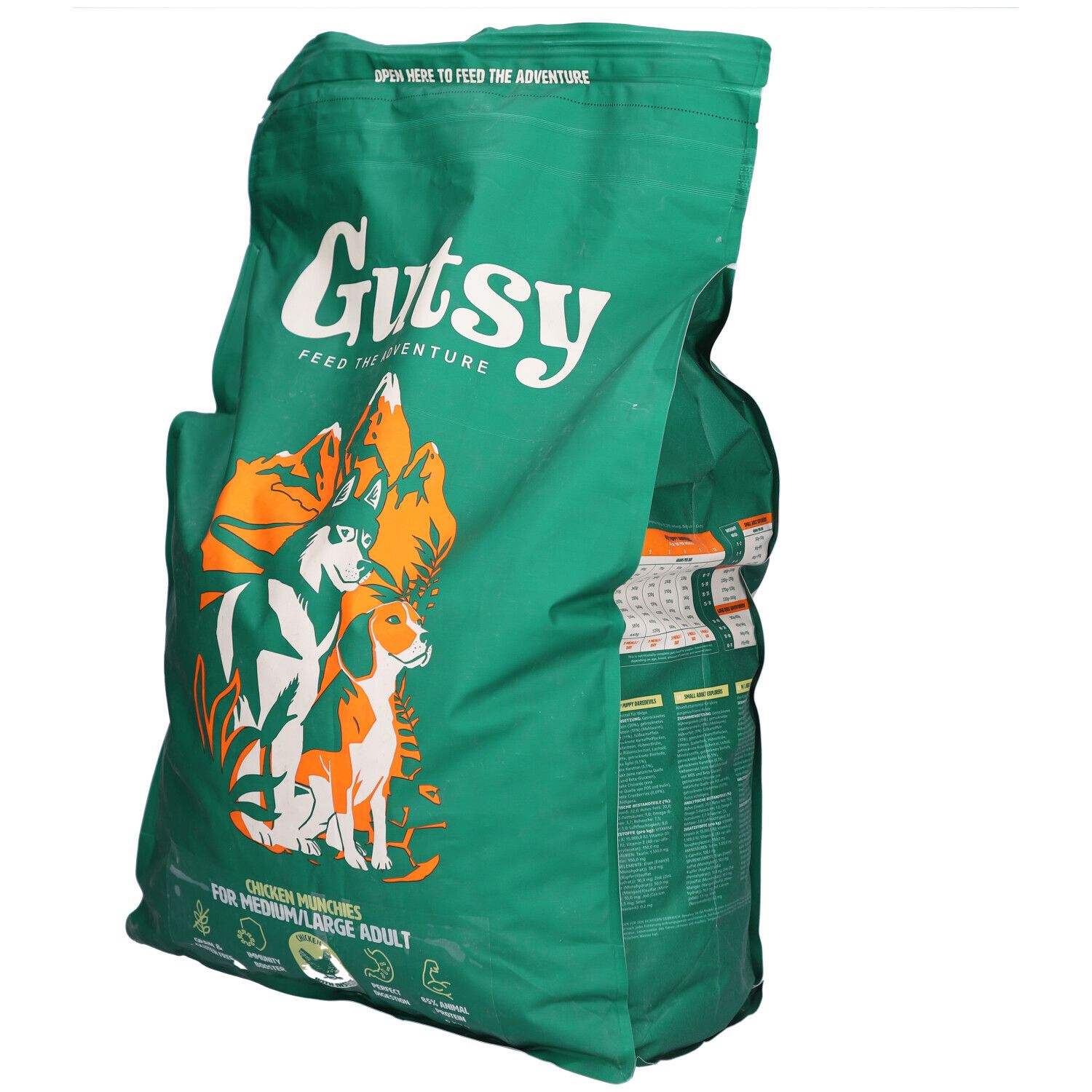 Sac vert Gutsy avec logo et chiens. Texte: Chicken Munchies pour chiens moyens/grands. Fermeture éclair en haut.