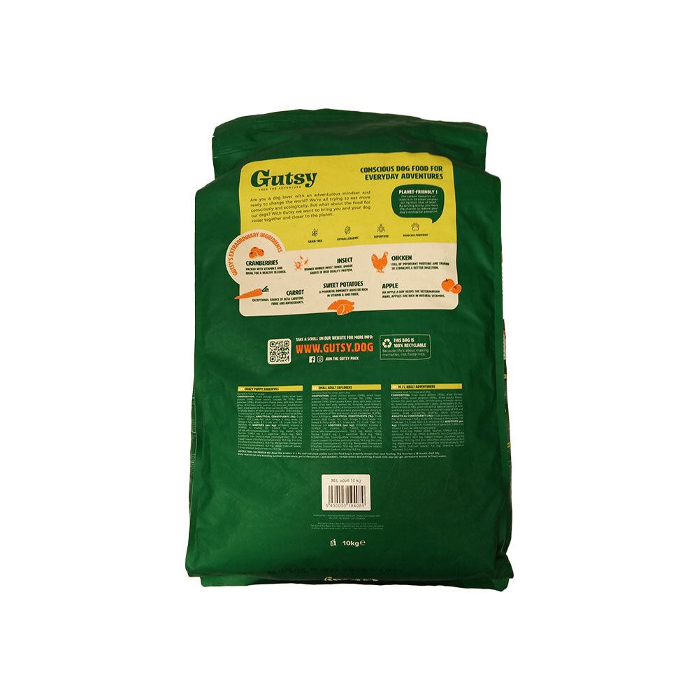 Emballage vert avec informations produit. Inscription : Gutsy. Contient carottes, patates douces et pommes. Vue arrière.