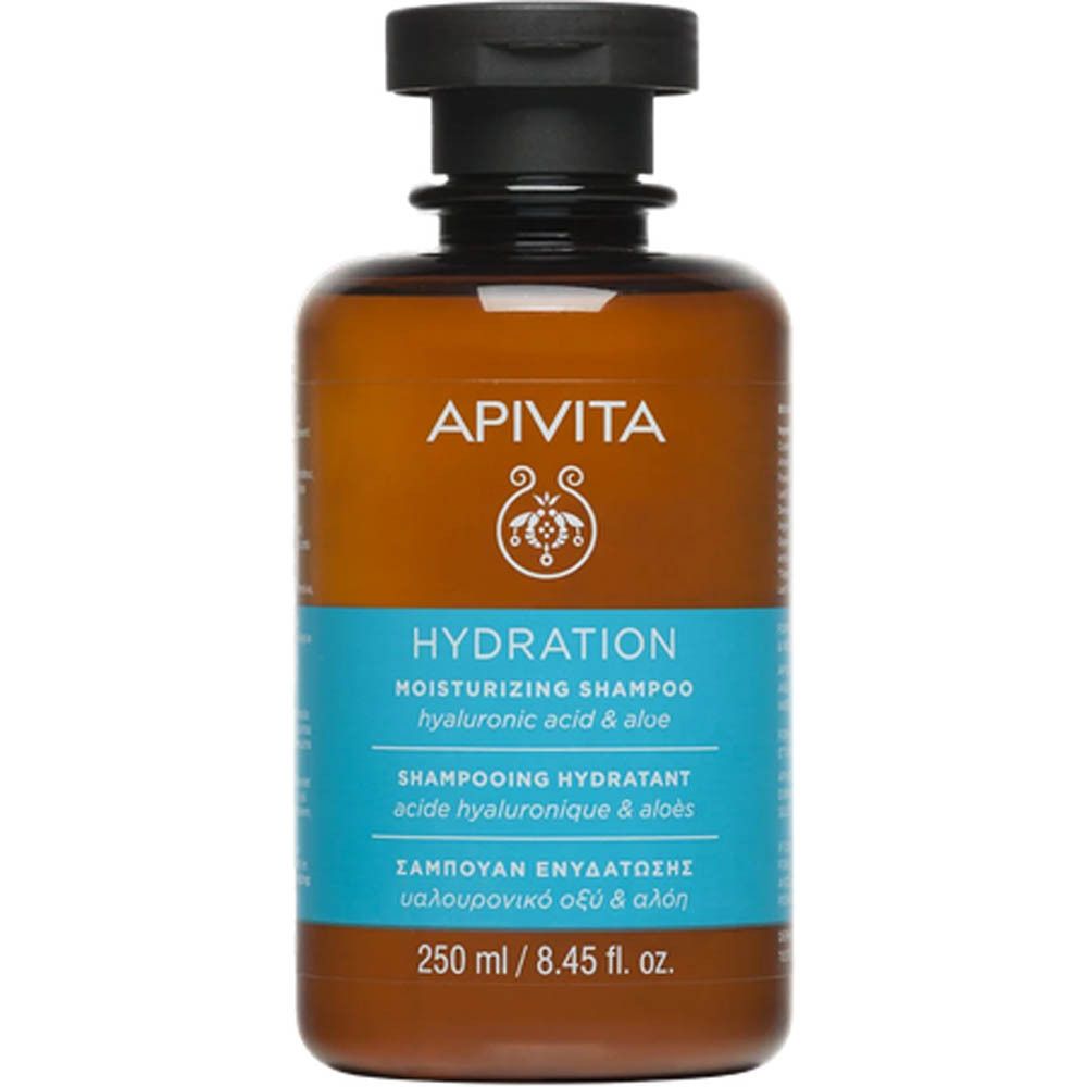 Flacon marron avec bouchon noir. Inscription : Apivita, Hydration, Shampooing Hydratant. Étiquette bleue avec texte.