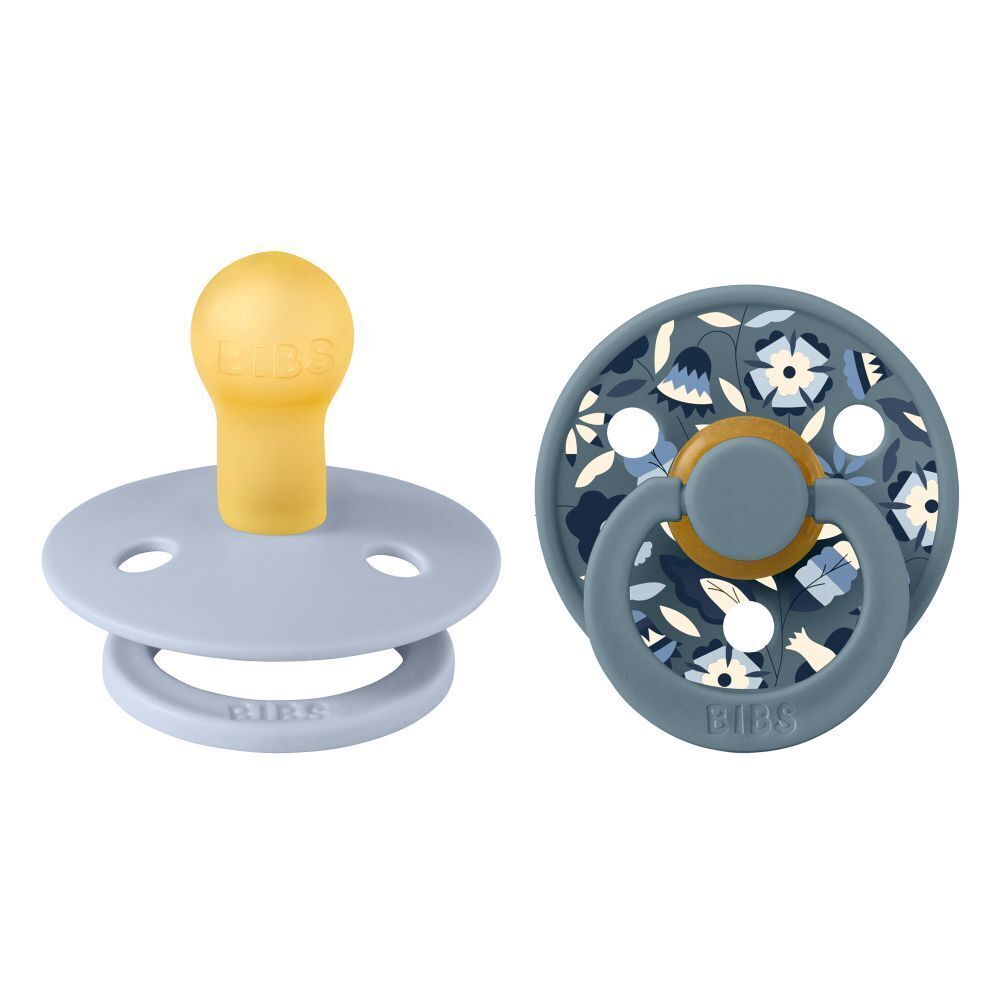 Deux sucettes. Bleu, jaune. Forme ronde. Logo BIBS. Motif floral. 0-6 mois.