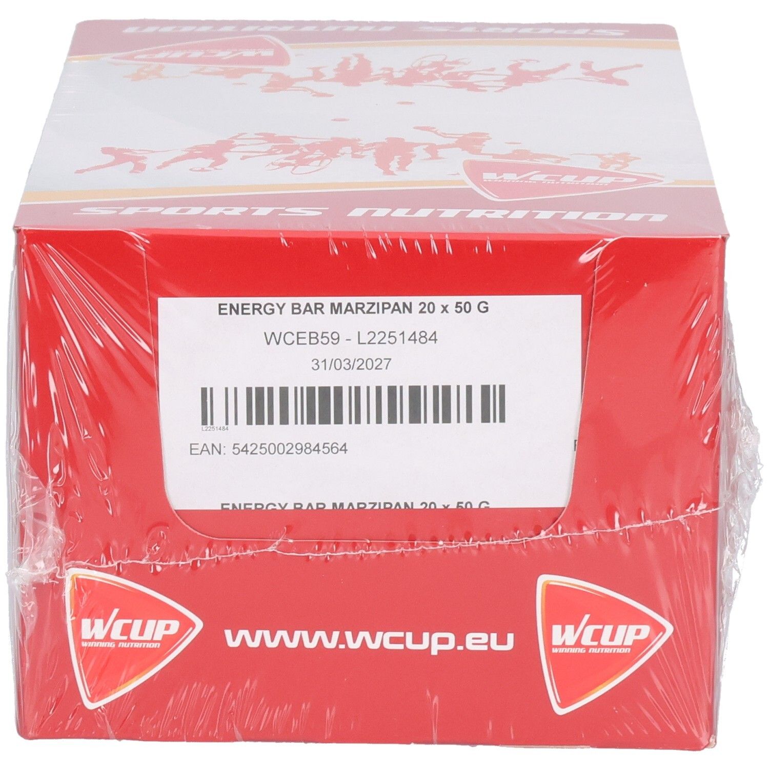 Emballage carton rouge, enveloppé de plastique transparent. Inscriptions: ENERGY BAR MARZIPAN 20 x 50 G, logo Wcup, www.wcup.eu et Sports Nutrition.