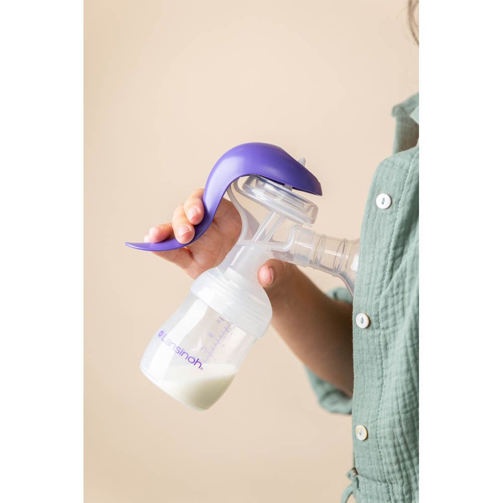 Tire-lait manuel. Marque Lansinoh. Violet et blanc.