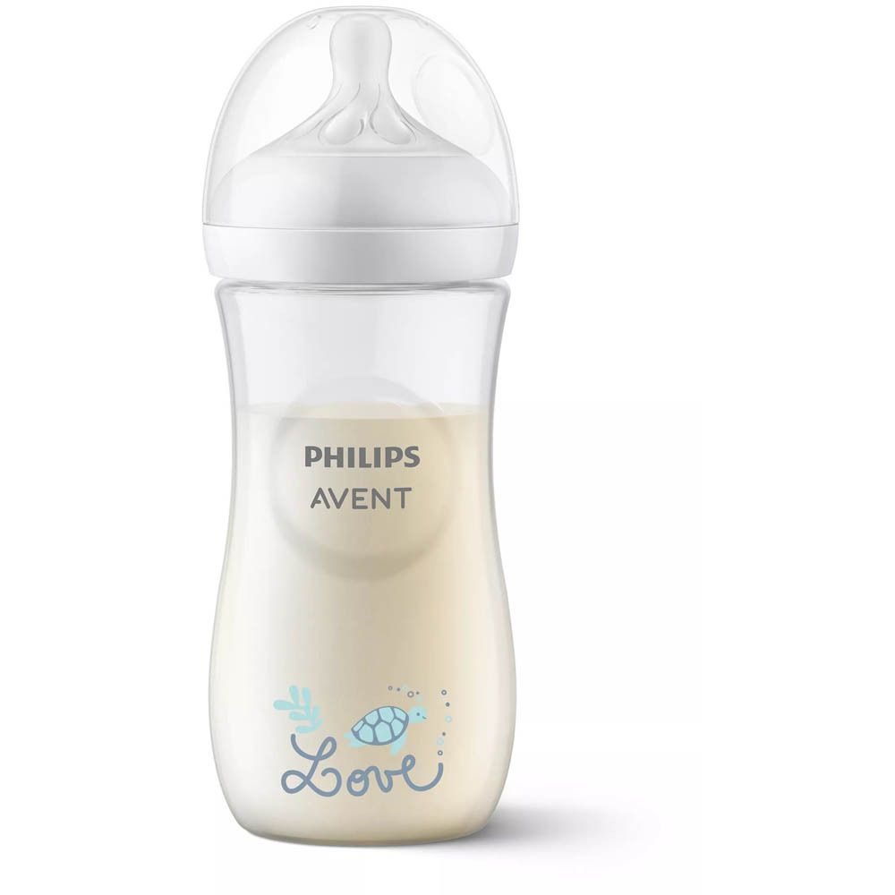 Biberon Philips Avent avec du lait. Couvercle blanc, biberon transparent. Logo et texte.