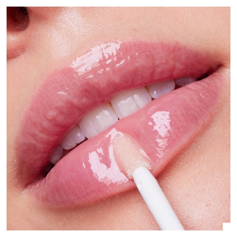 Sérum lèvres Nuxe avec capuchon rose et applicateur.