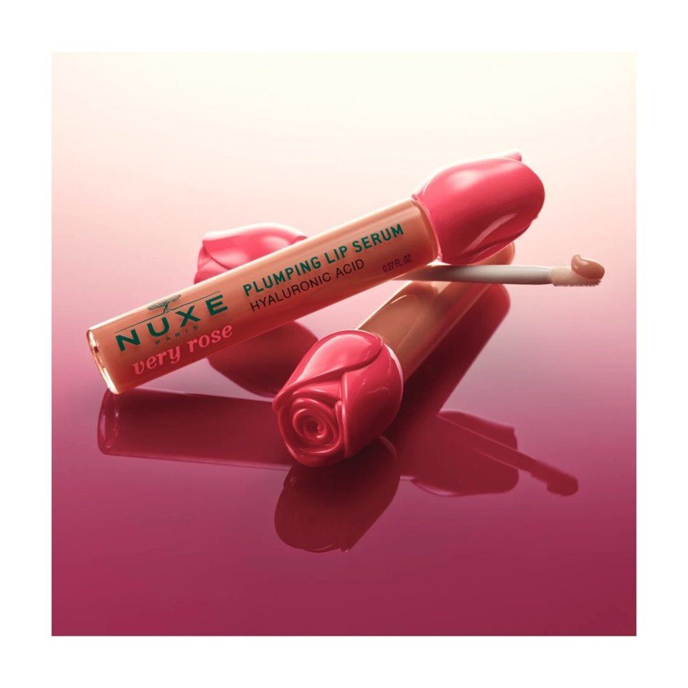 Sérum lèvres Nuxe avec capuchon rose et applicateur.