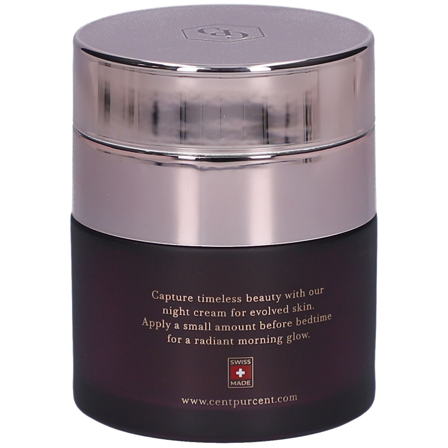Pot rond avec couvercle argenté. Texte : Capture timeless beauty with our night cream... Swiss Made.