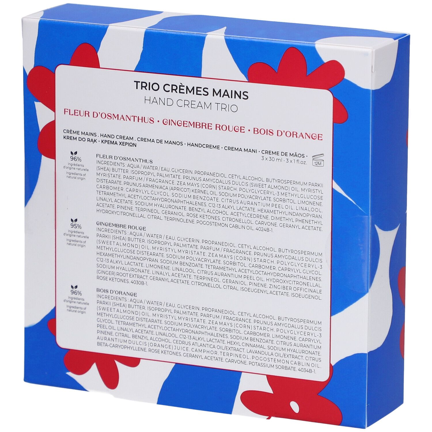 Dos du coffret cadeau avec informations et ingrédients. Boîte bleue à motifs floraux. Texte multilingue.