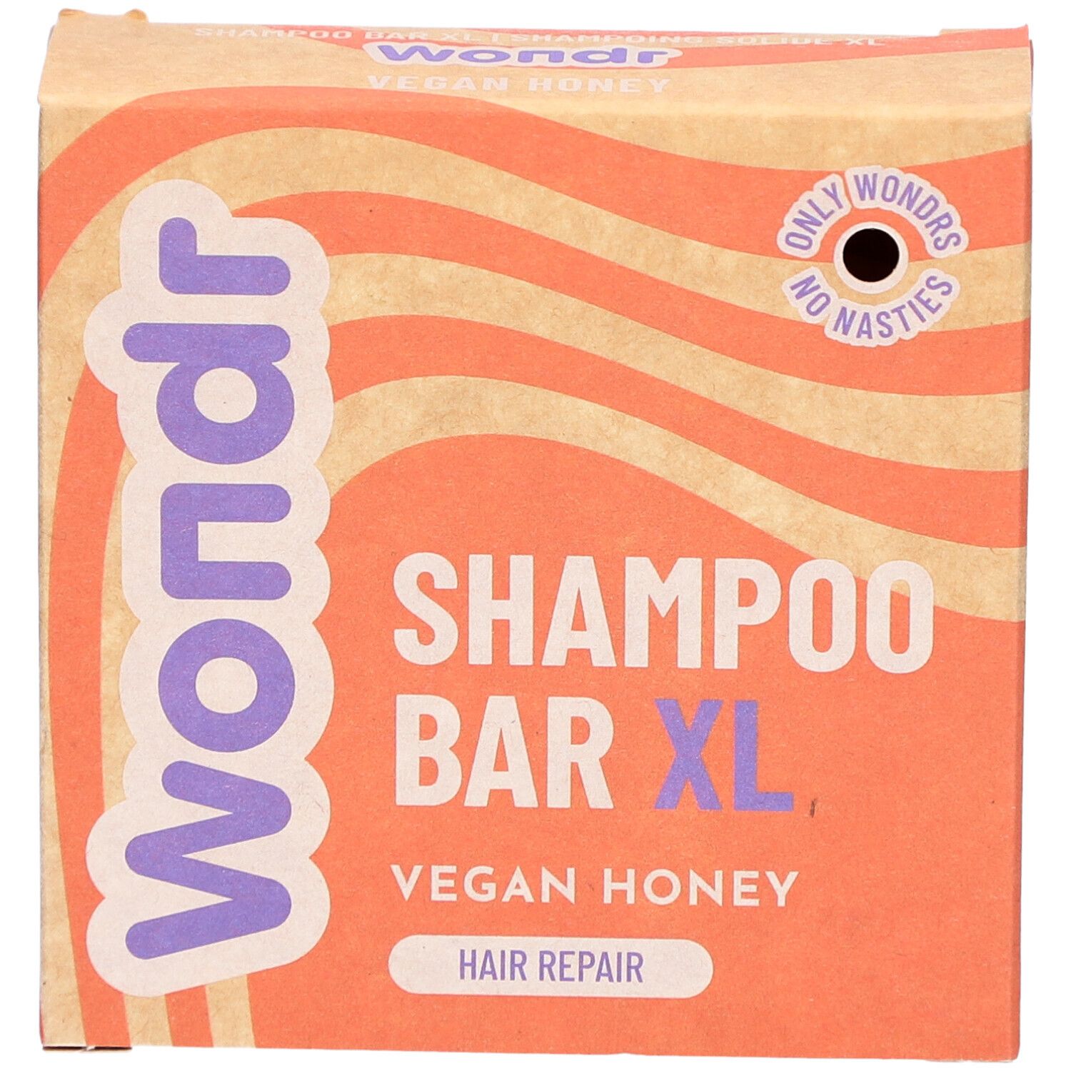 Emballage en carton Wondr, Shampoo Bar XL, Vegan Honey. Fond ondulé orange et beige.