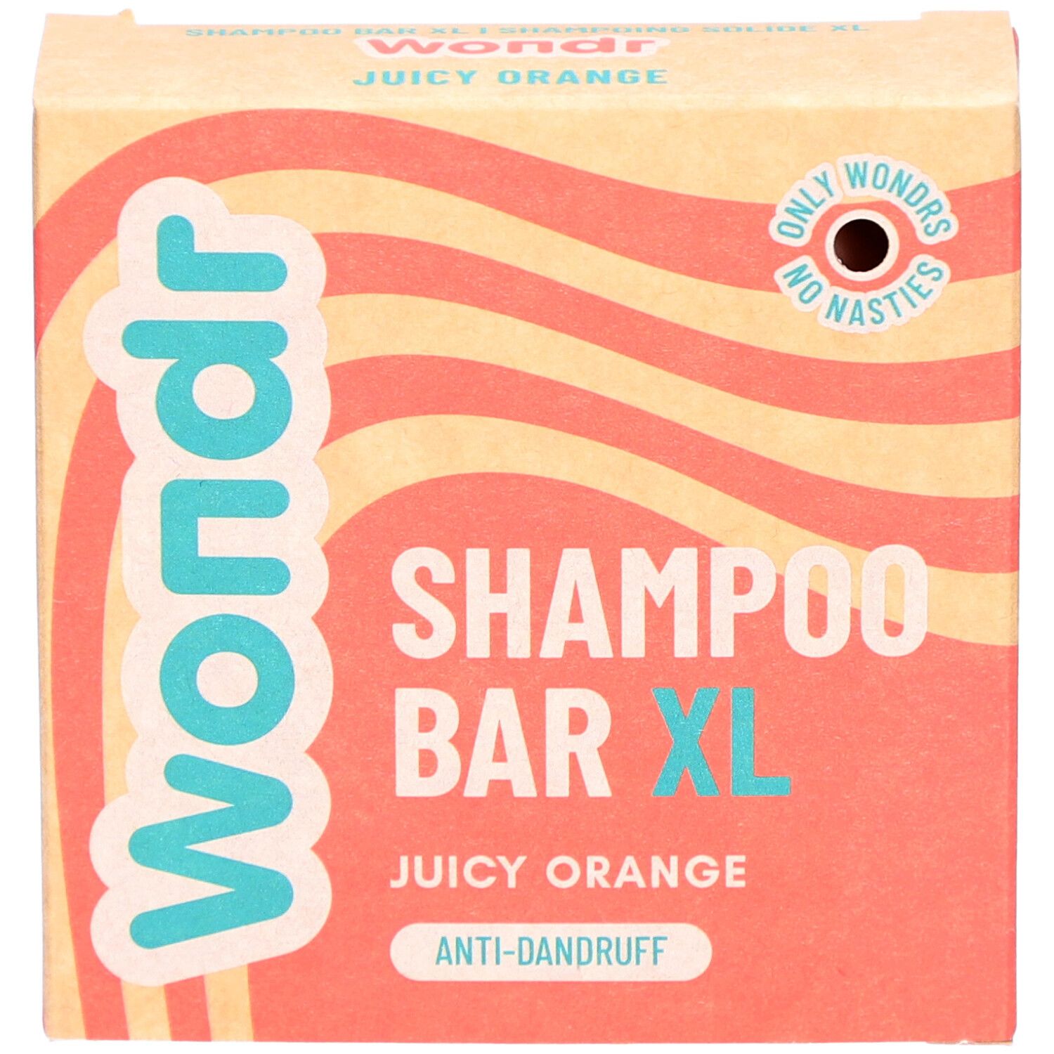 Face avant de l'emballage en carton. Inscription "Wondr Shampoo Bar XL Juicy Orange" et logo.