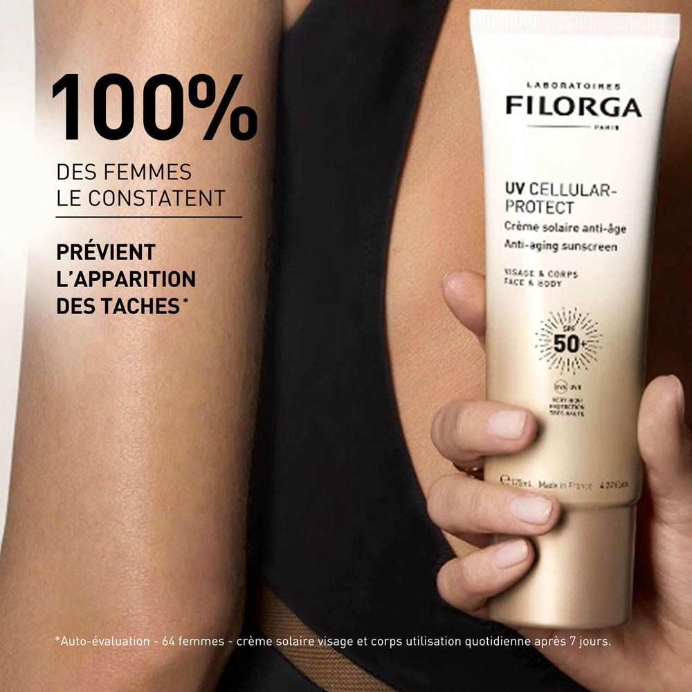 Femme avec FILORGA UV Cellular-Protect. Texte: 100% des femmes le constatent. Prévient l'apparition des taches.