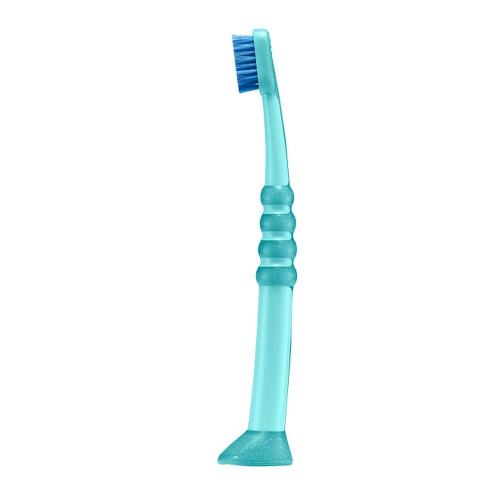 Brosse à dents bleue pour bébé, vue latérale. Manche bleu avec trois renfoncements.