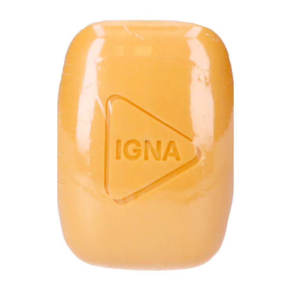 Pain de savon jaune avec logo triangulaire. Emballé de manière transparente. Le mot "IGNA" est imprimé sur le savon.