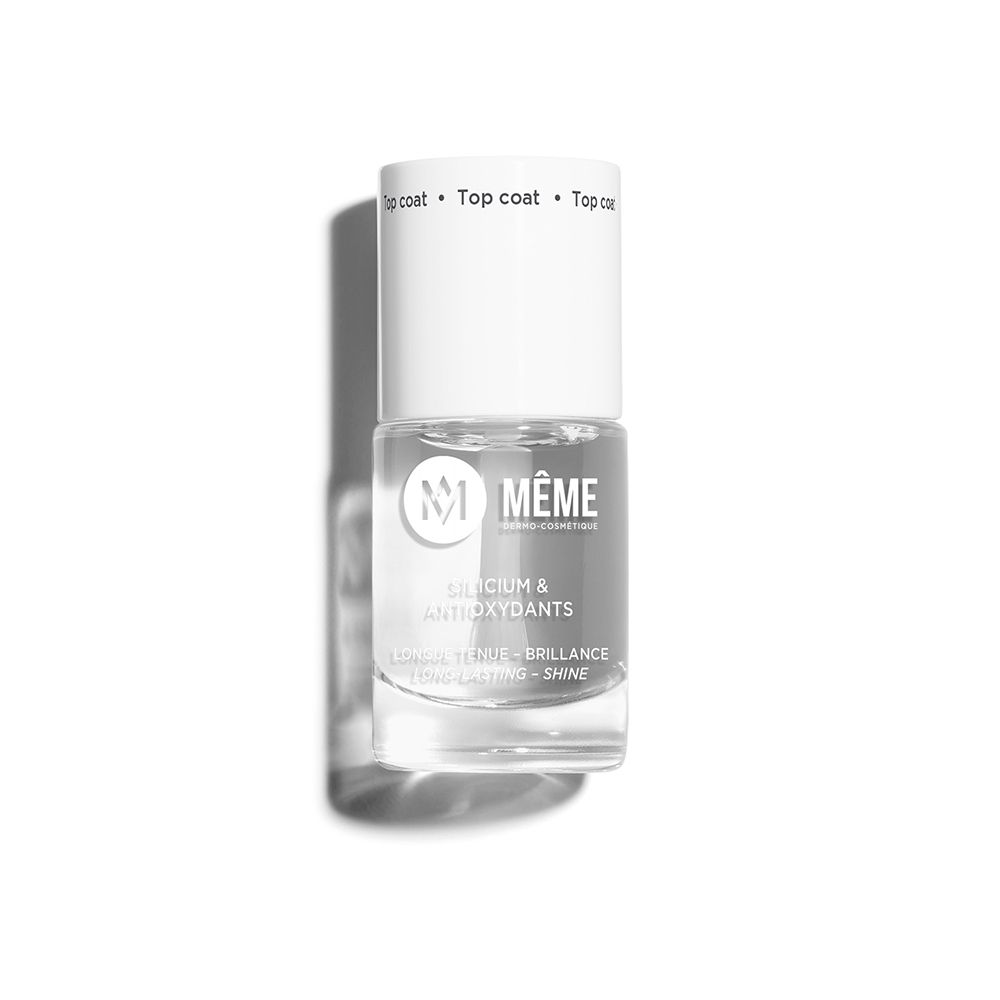 Flacon de vernis à ongles transparent avec bouchon blanc. Inscription: Top Coat. Nom du produit: MEME. Contient du silicium et des antioxydants.