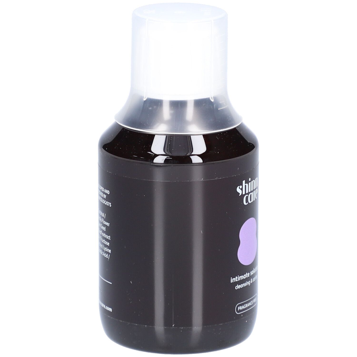 Flacon foncé avec bouchon blanc. Logo, nom du produit et 'FRAGRANCE FREE' visibles.