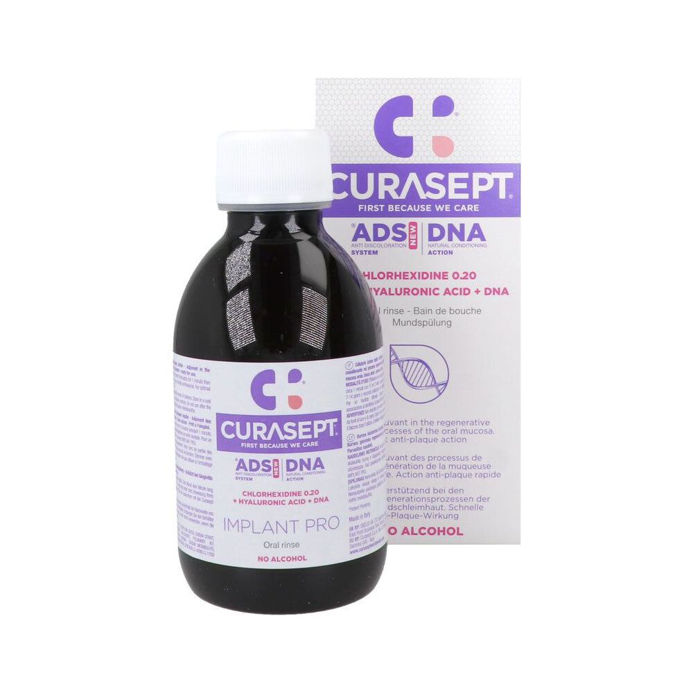 Bain de bouche Curasept ADS DNA Implant Pro dans une bouteille foncée avec bouchon blanc, à côté de l'emballage.