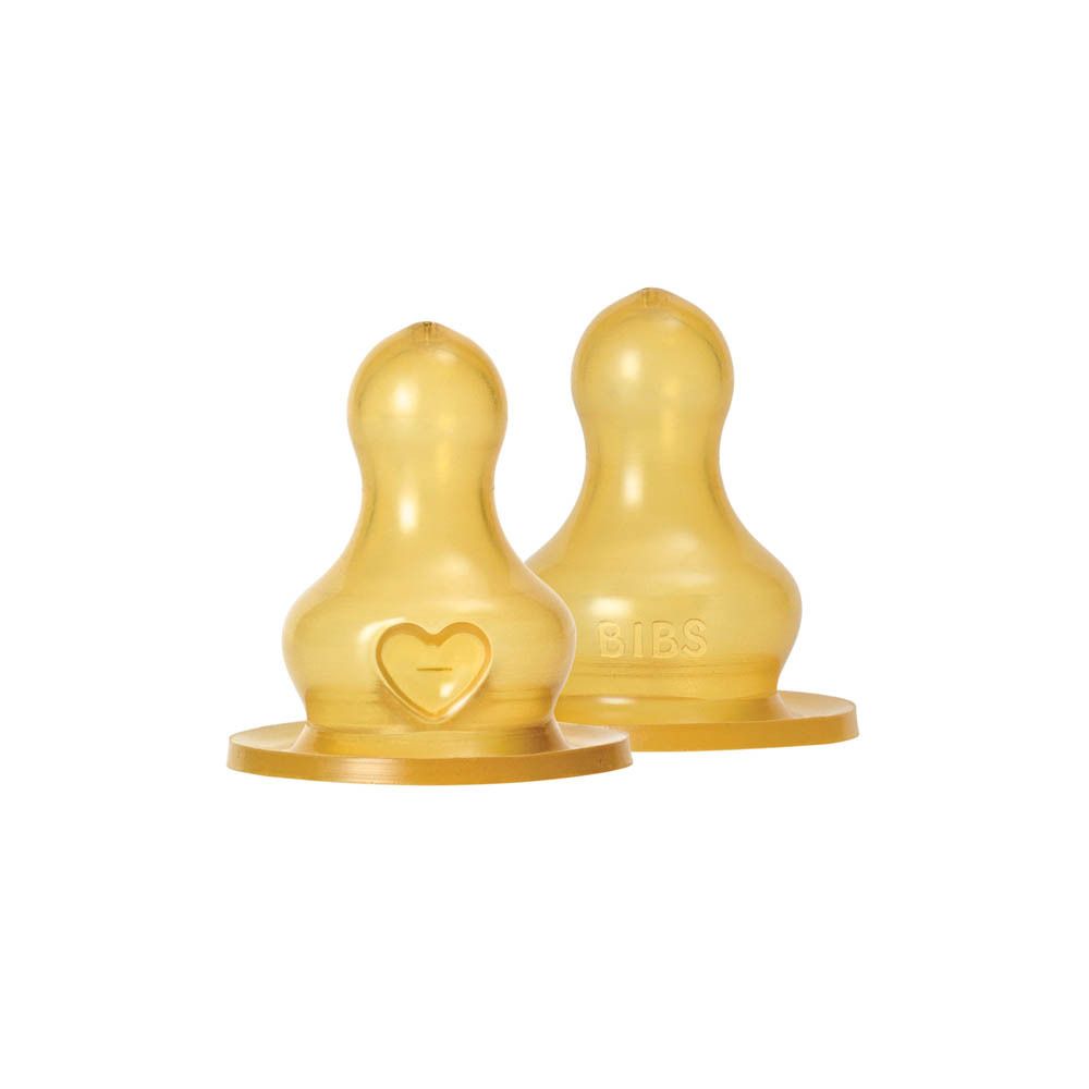 Deux tétines en latex jaunes. Forme ronde, cœur. Logo BIBS. Pour biberons.