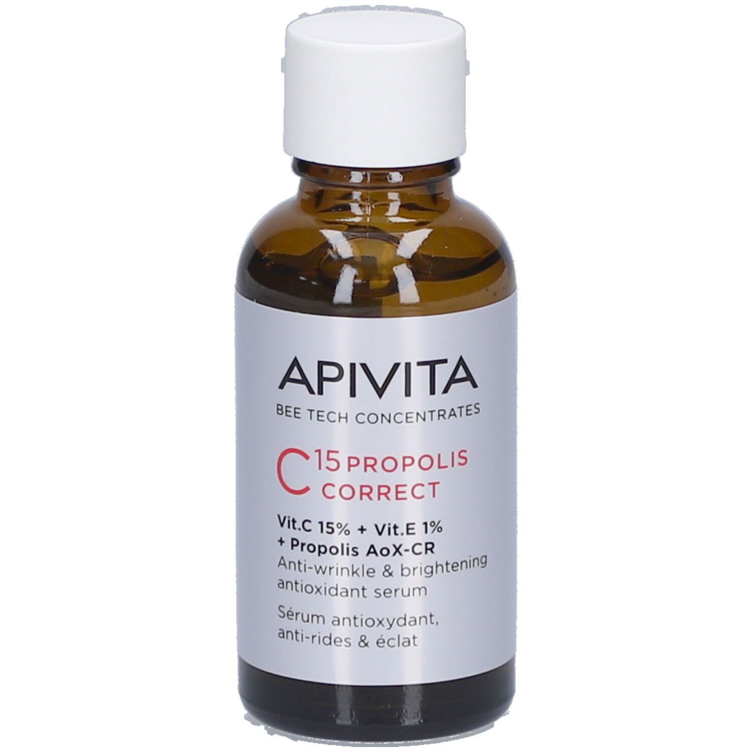 Flacon en verre brun avec bouchon blanc. Étiquette avec nom du produit et ingrédients. Marque : Apivita.