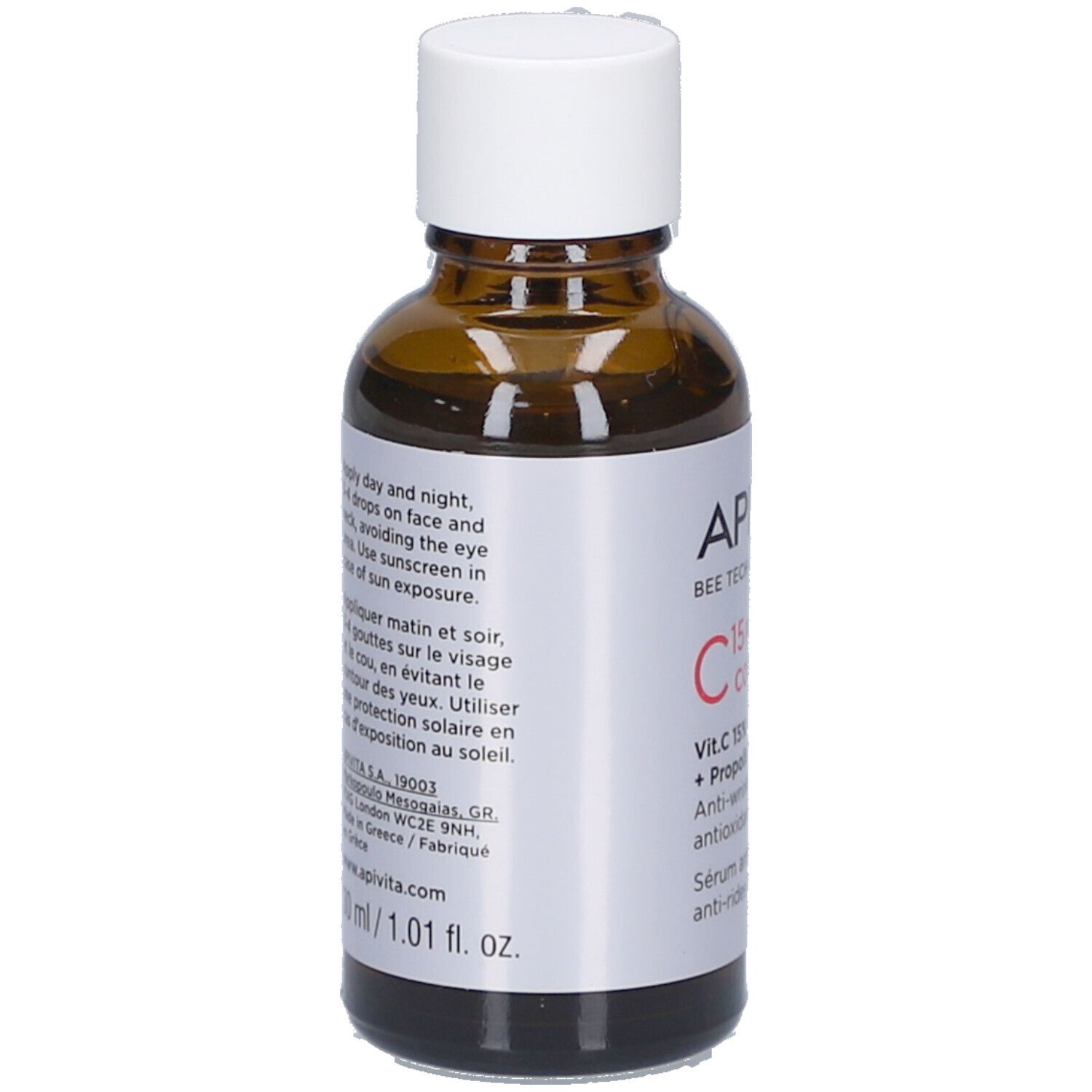 Flacon en verre brun avec bouchon blanc. Étiquette avec informations et instructions. Marque : Apivita.