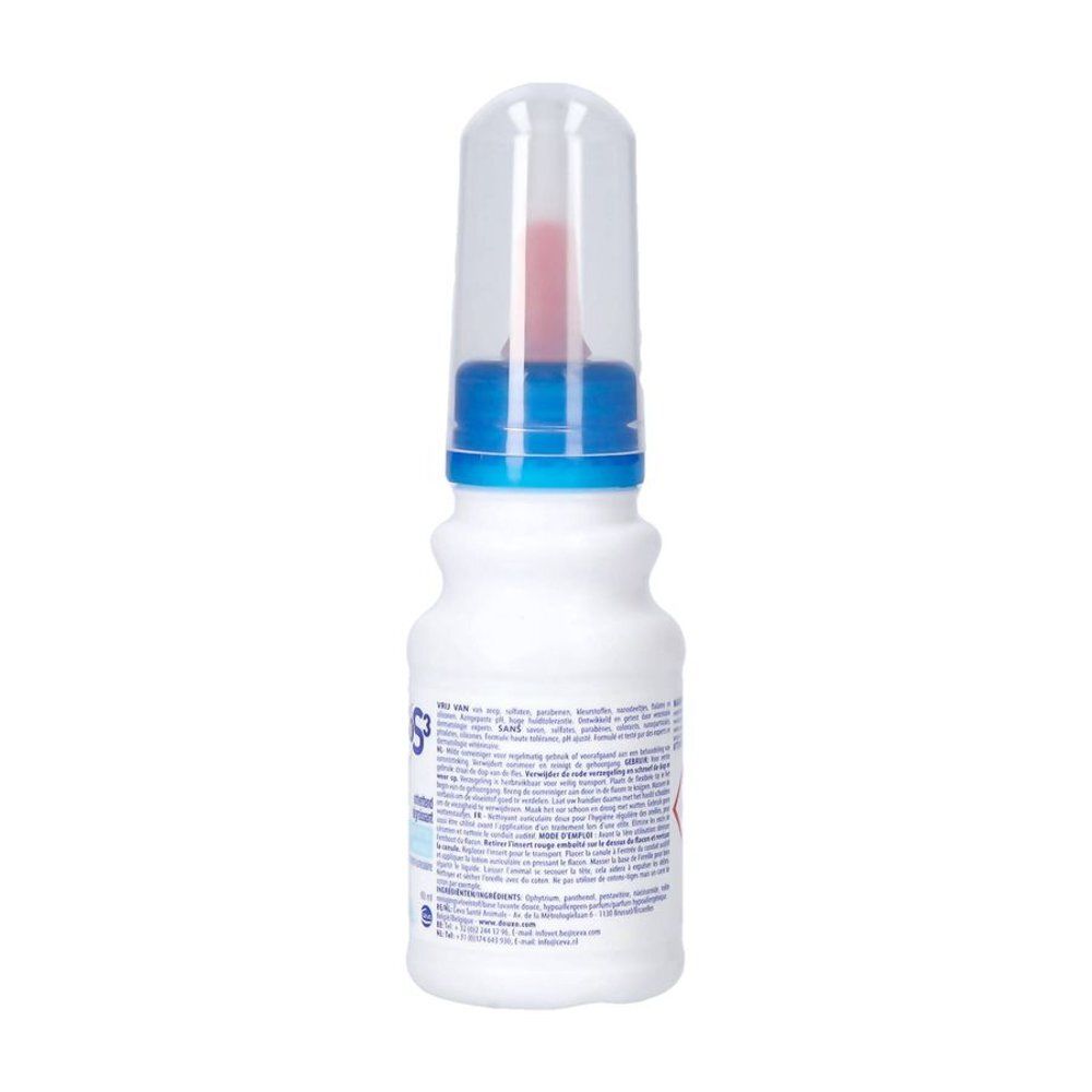Boîte aérosol blanche avec informations produit et symboles de danger.