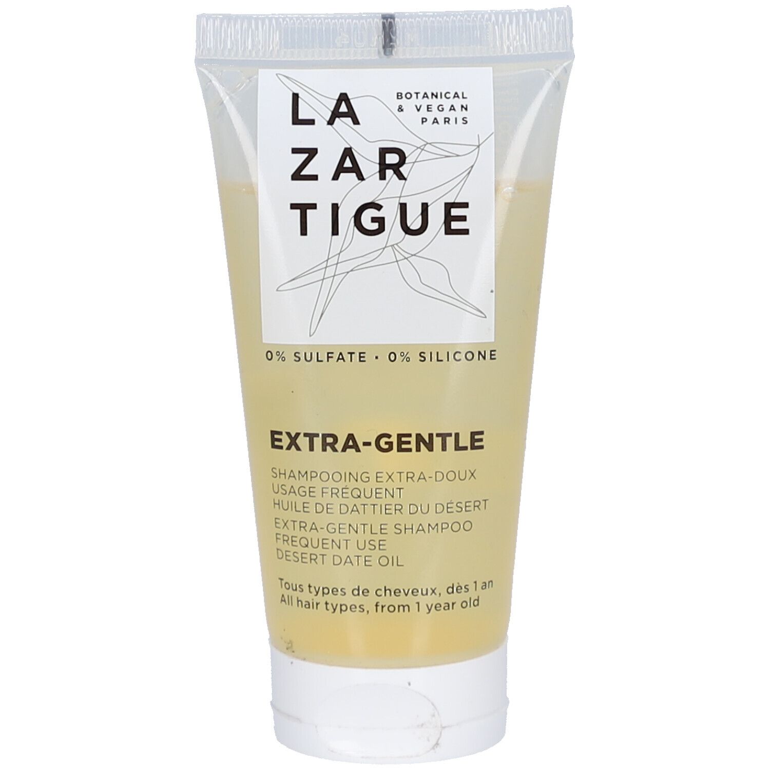 Tube transparent de shampooing avec liquide jaunâtre. Inscription: Lazartigue, Extra-Gentle, 0% Sulfate, 0% Silicone.