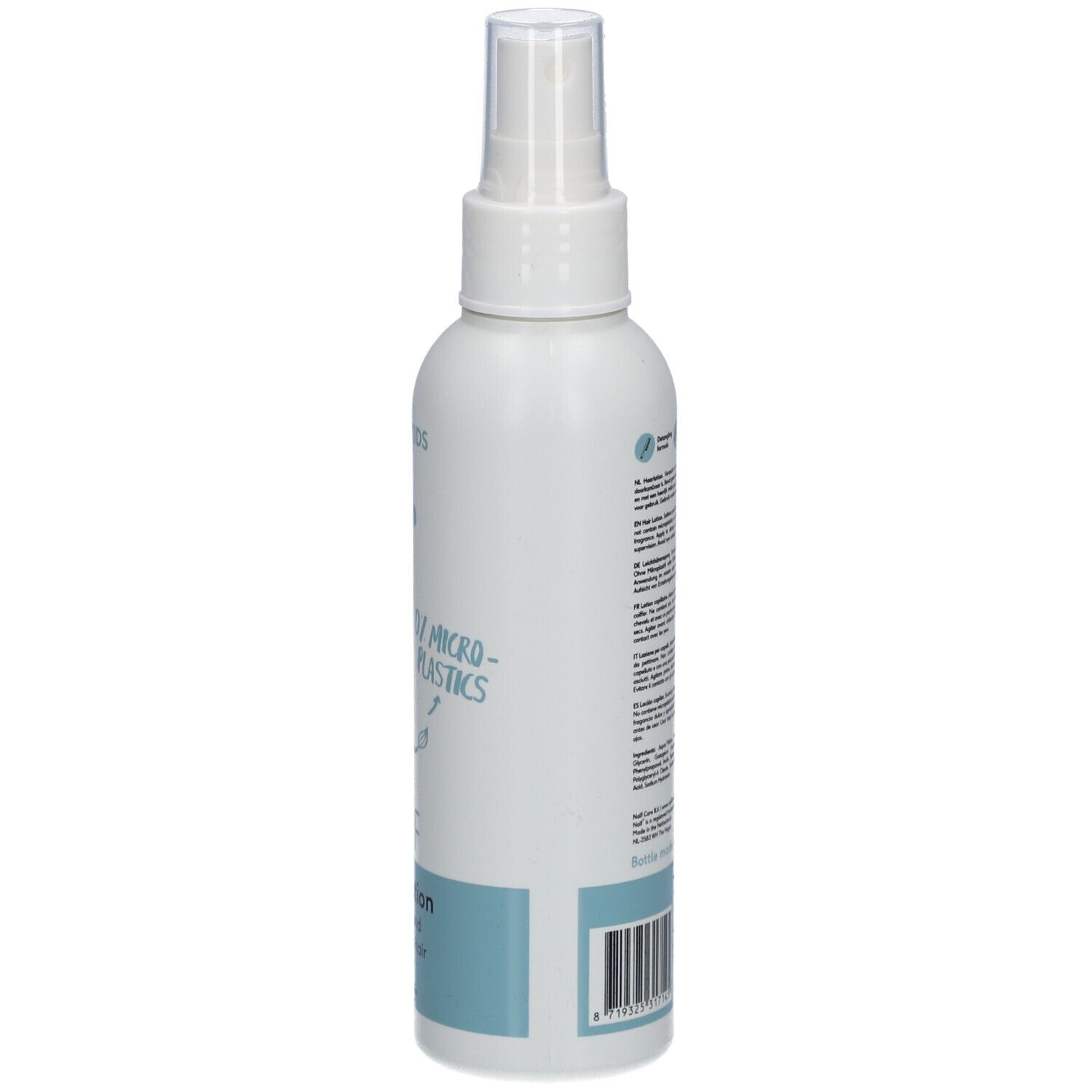 Flacon blanc avec vaporisateur. Inscription : Naïf, Hair Lotion. Texte au dos. Pour bébés et enfants.