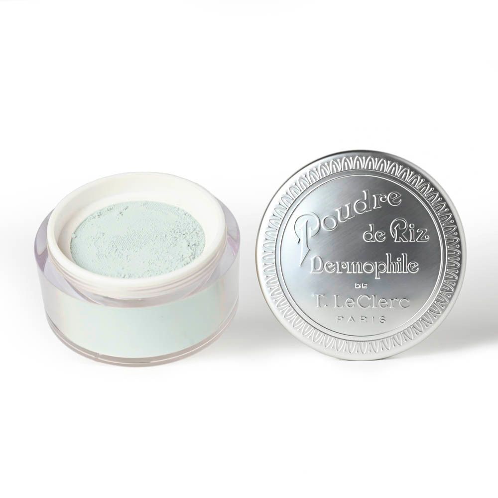 Poudrier ouvert, argenté, avec Poudre de Riz Dermophile. Poudre verte visible.