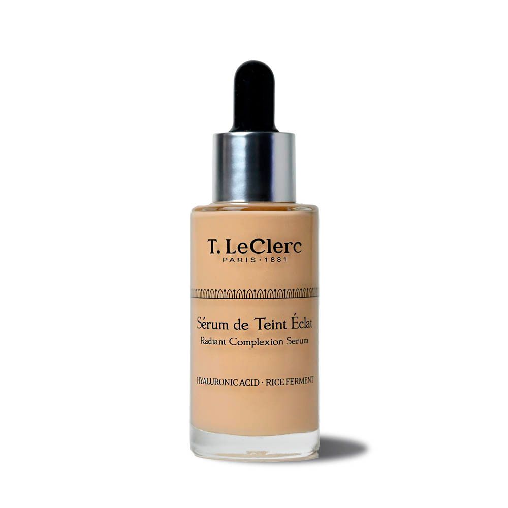 Flacon de sérum T. LeClerc avec pipette. Inscription: Sérum de Teint Éclat, Radiant Complexion Serum. Contient acide hyaluronique et ferment de riz.
