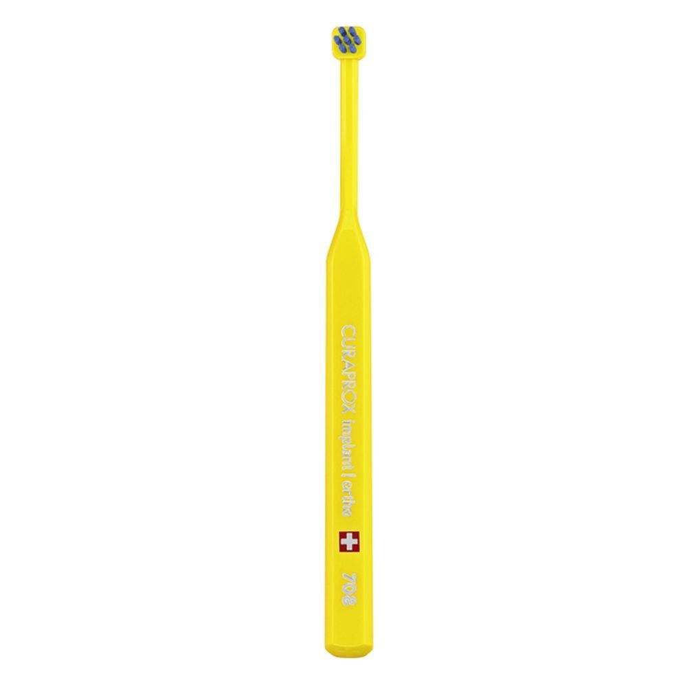 Brosse à dents jaune avec tête grise. Inscription CURAPROX implant ortho, croix suisse.