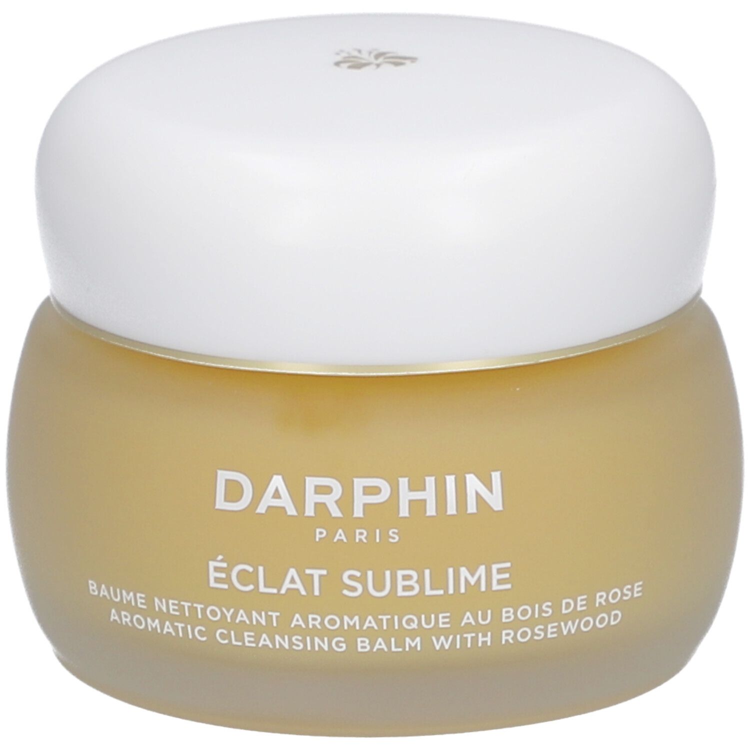 Pot rond en verre avec crème jaunâtre et couvercle blanc. Texte: Darphin, Eclat Sublime, Baume nettoyant.