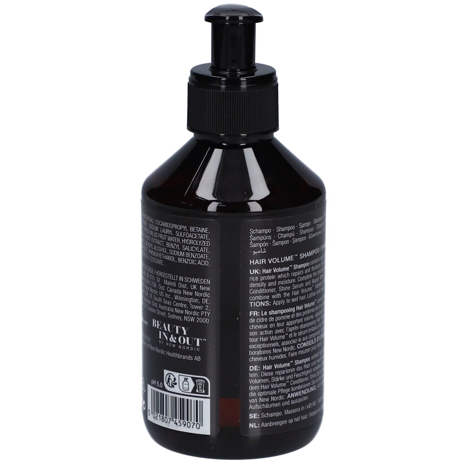 Flacon noir avec pompe noire. Texte : Hair Volume Shampooing. Ingrédients et informations fabricant.