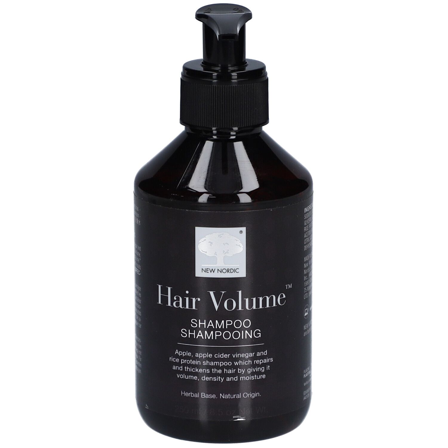 Flacon noir avec pompe noire. Inscription : Hair Volume Shampooing. Texte : Pomme, vinaigre de cidre et protéine de riz.