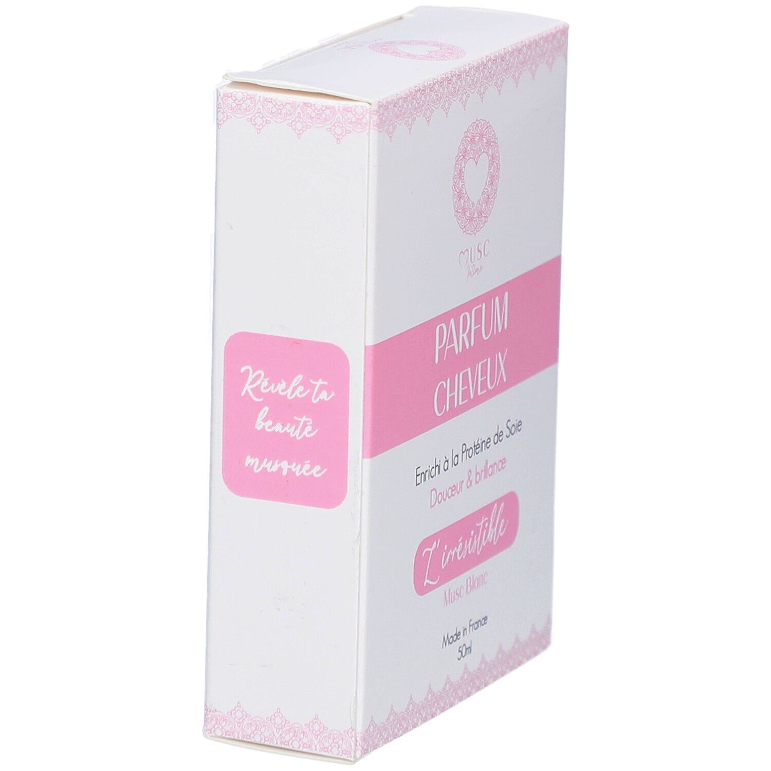 Boîte blanche avec détails roses. Texte: PARFUM CHEVEUX, L'irrésistible, Musc Blanc, Made in France, 30ml.