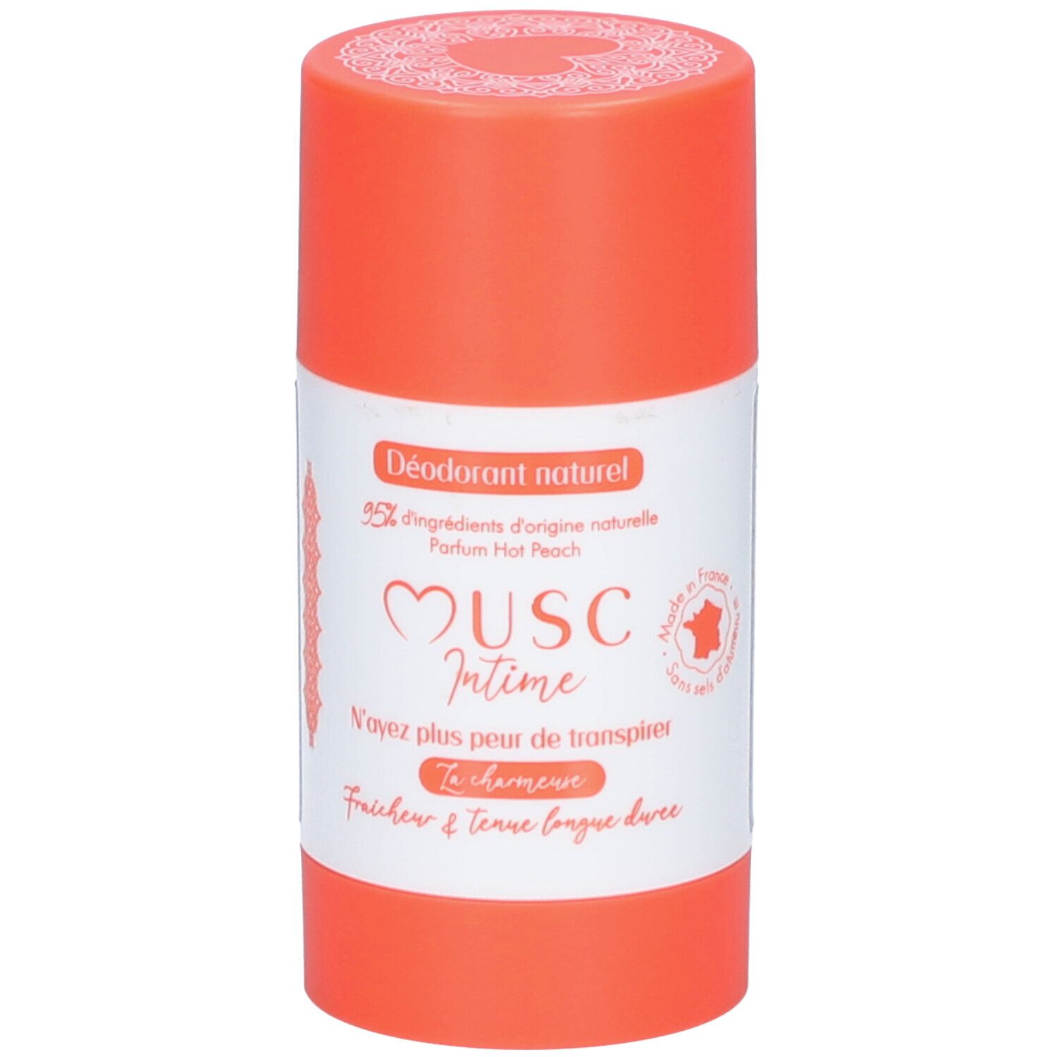 Stick de déodorant. Récipient orange avec étiquette blanche. Texte: Musc Intime, Hot Peach. Inscription française.