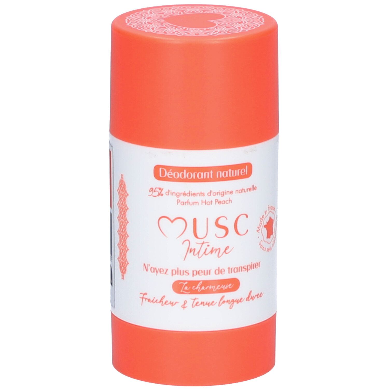 Stick de déodorant. Récipient orange avec étiquette blanche. Texte: Musc Intime, Hot Peach. Inscription française.