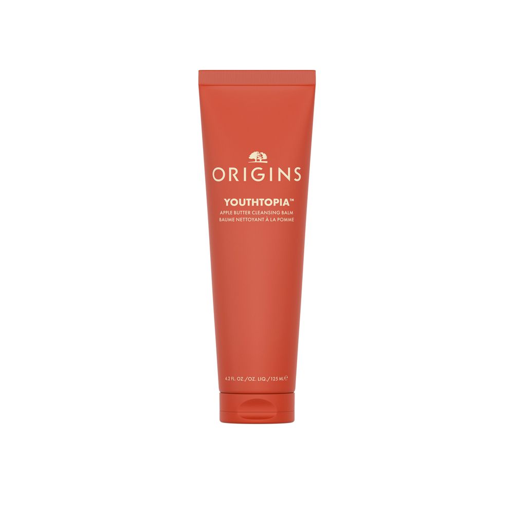Tube rouge avec texte blanc: Origins Youthtopia Apple Butter Cleansing Balm. Logo en haut.