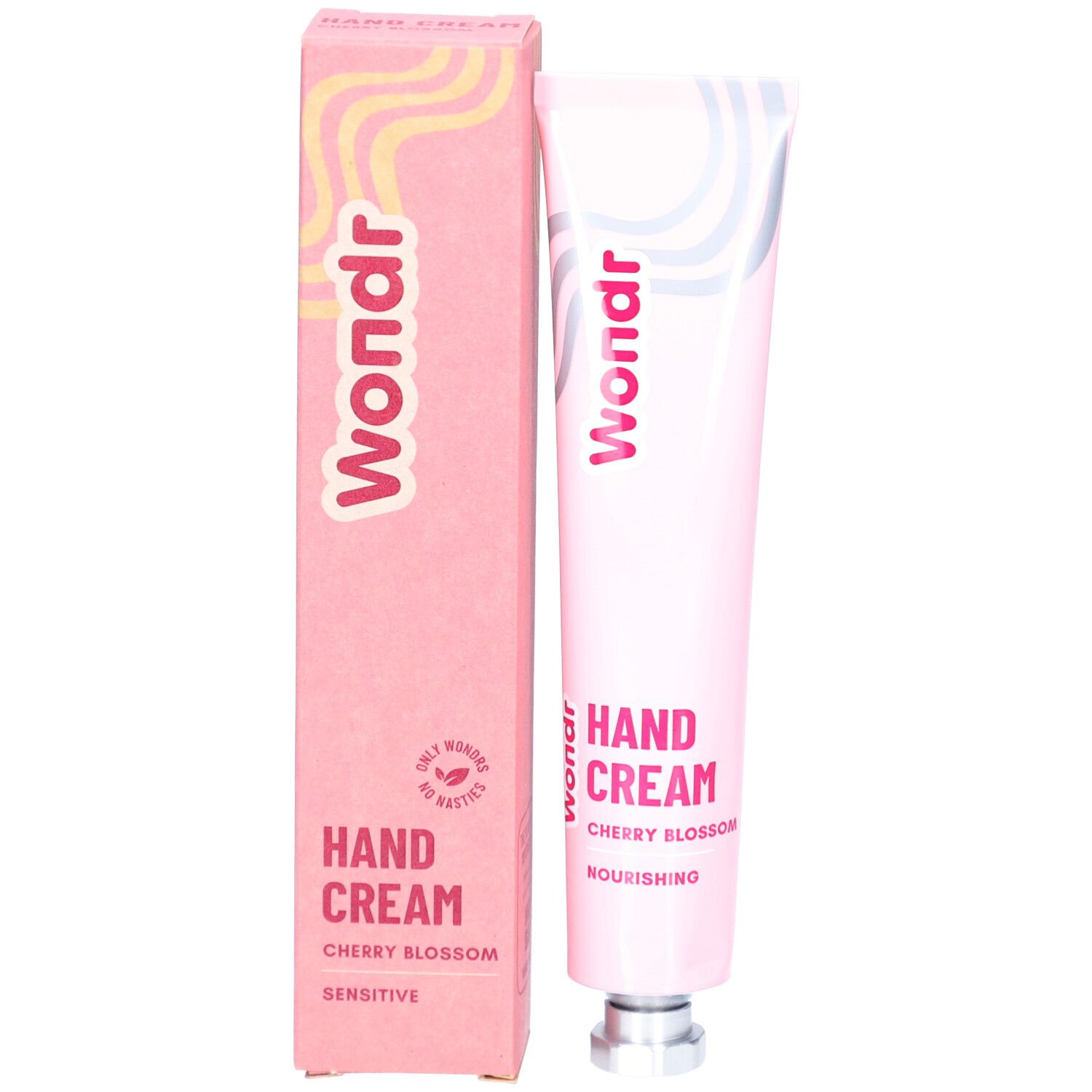 Boîte et tube roses. Sur la boîte, on lit "Wondr", "Hand Cream Cherry Blossom" et "Sensitive".