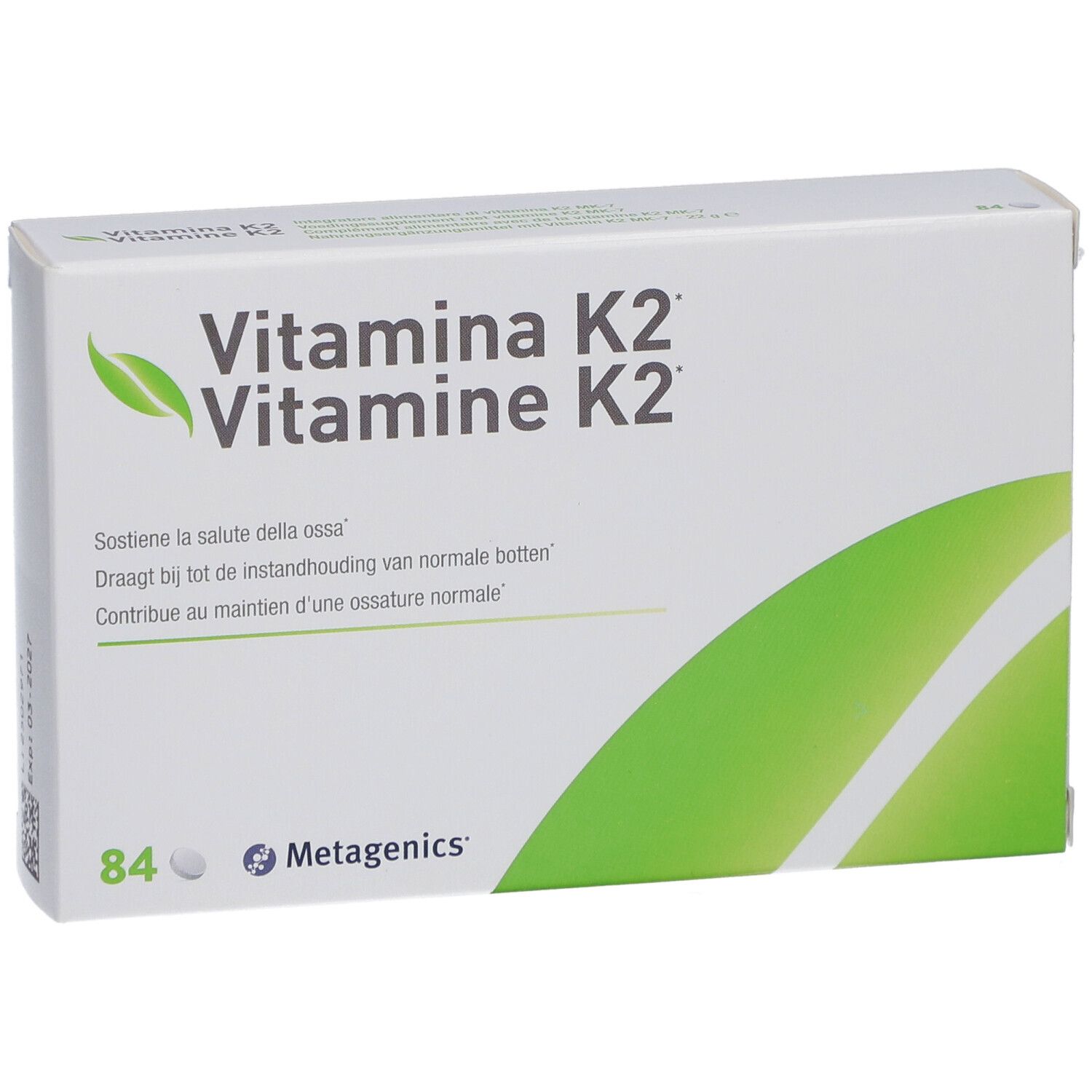 Boîte blanche avec "Vitamina K2". Contient 84 comprimés. Marque: Metagenics. Logo feuille verte.
