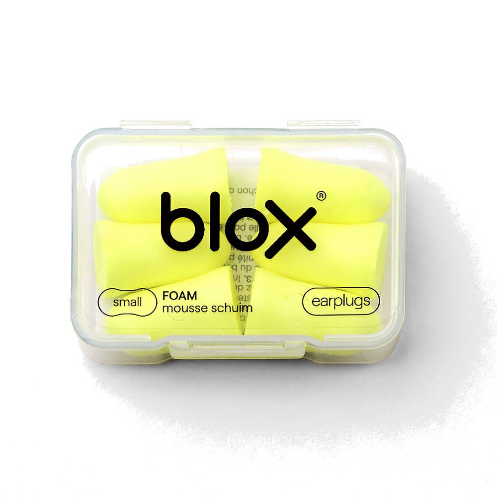 Bouchons d'oreilles Blox en mousse, petits, jaunes, dans une boîte de rangement transparente.