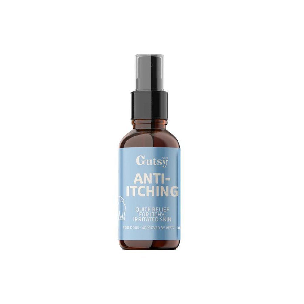 Flacon brun avec vaporisateur blanc. Étiquette bleu clair avec "Gutsy ANTI-ITCHING" et symbole de chien. Pour chiens.