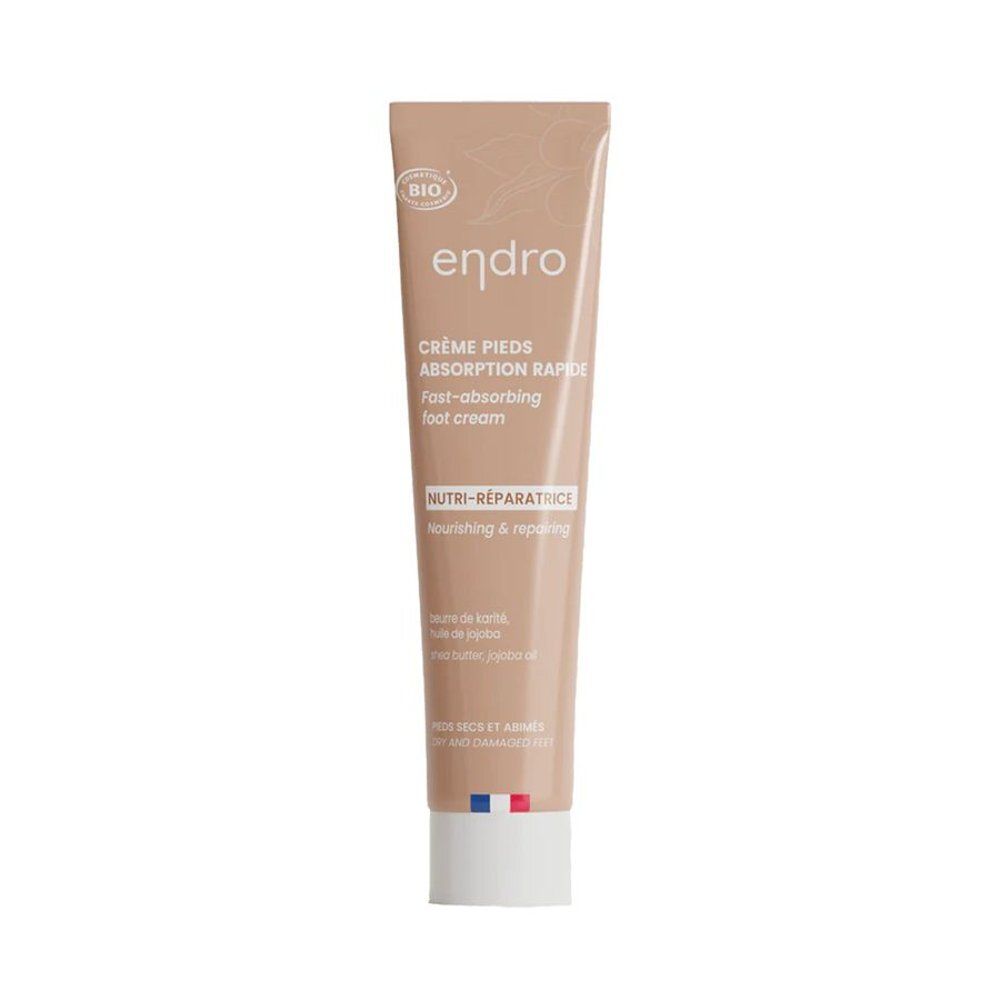 Tube beige avec bouchon blanc. Inscription: Endro, Crème Pieds, Absorption Rapide, Nutri-Réparatrice. Label Bio.