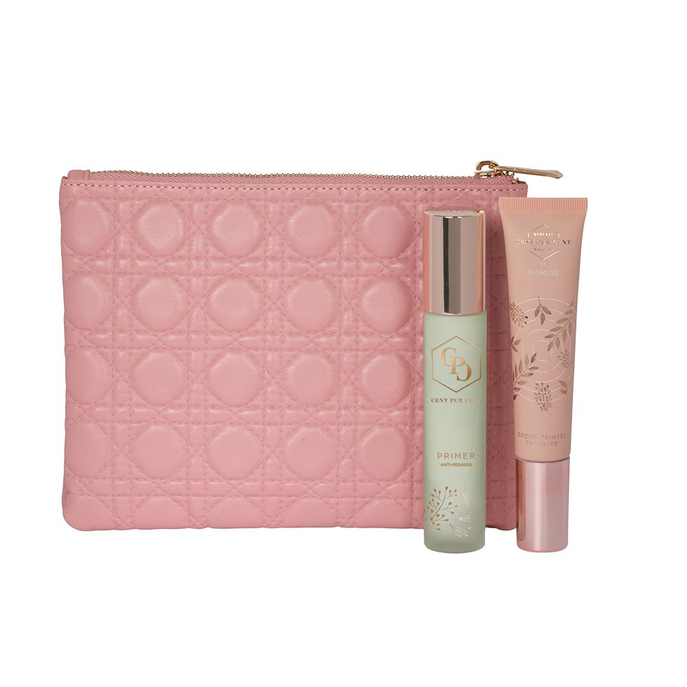 Trousse rose avec base et crème teintée. Fermeture éclair dorée. Produits debout.