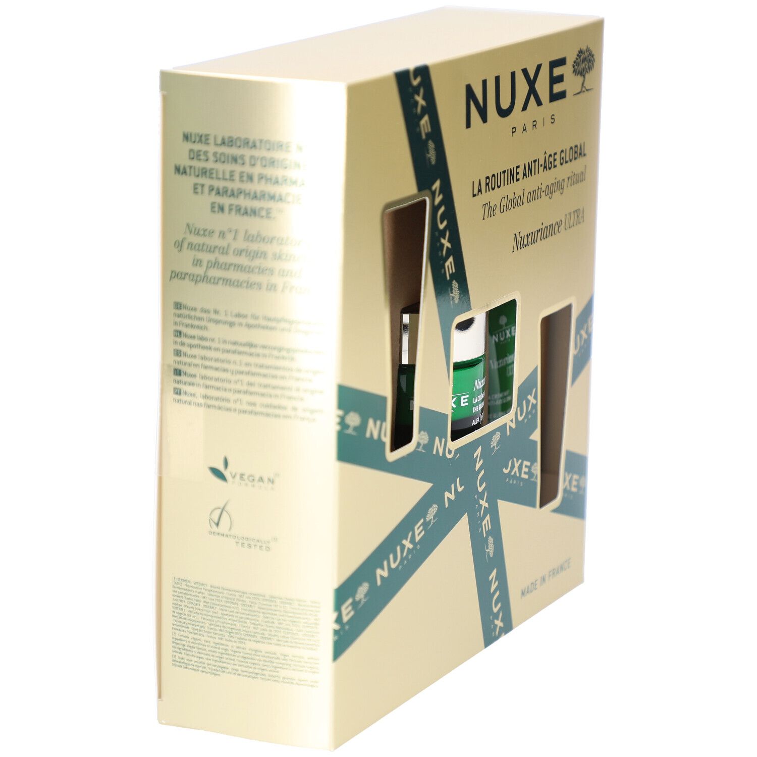 Vue latérale du coffret cadeau Nuxe. Montre l'emballage avec le nom du produit et le logo. Logo vegan visible.