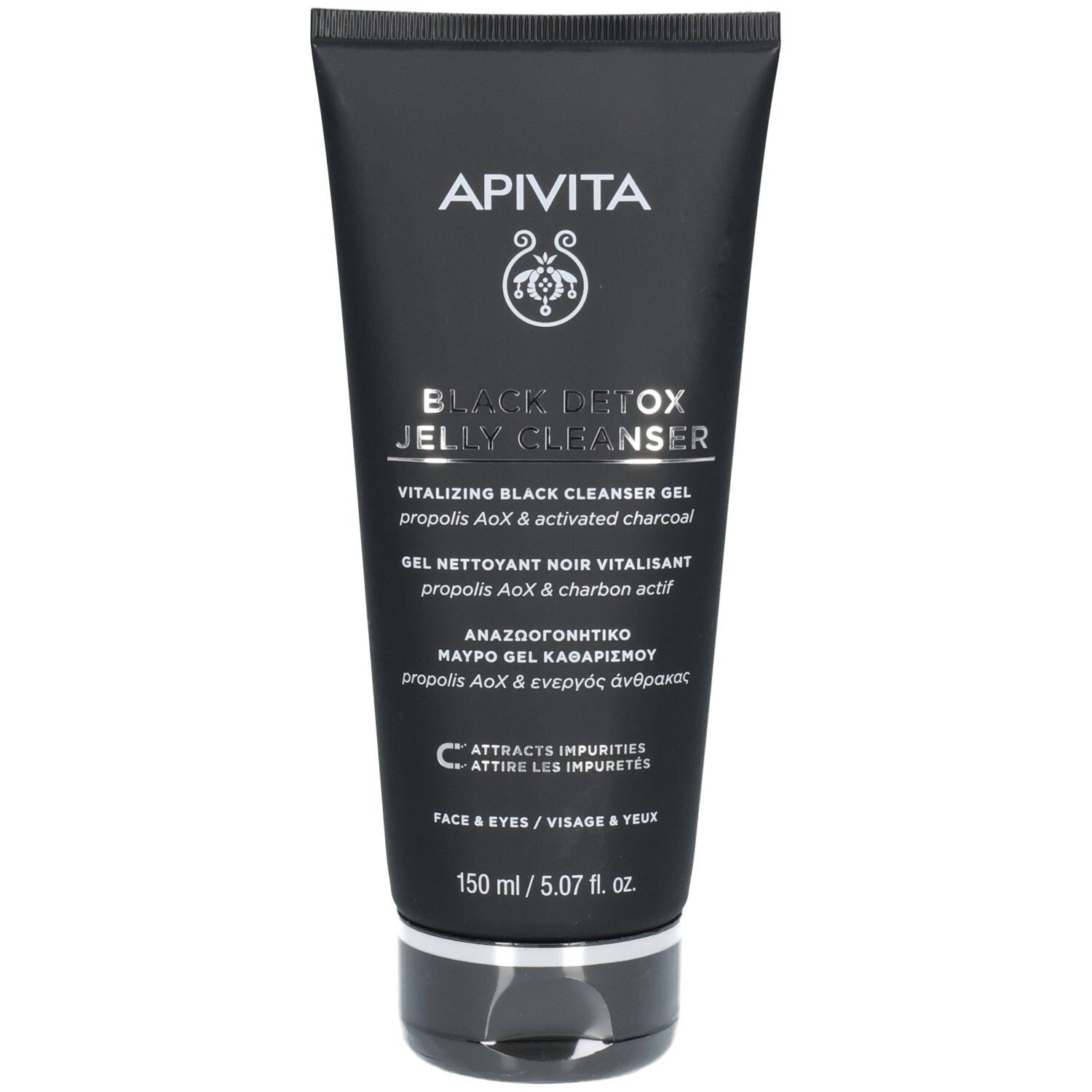 Tube noire contenant un gel nettoyant détox noir pour le visage et les yeux. Marque : Apivita.
