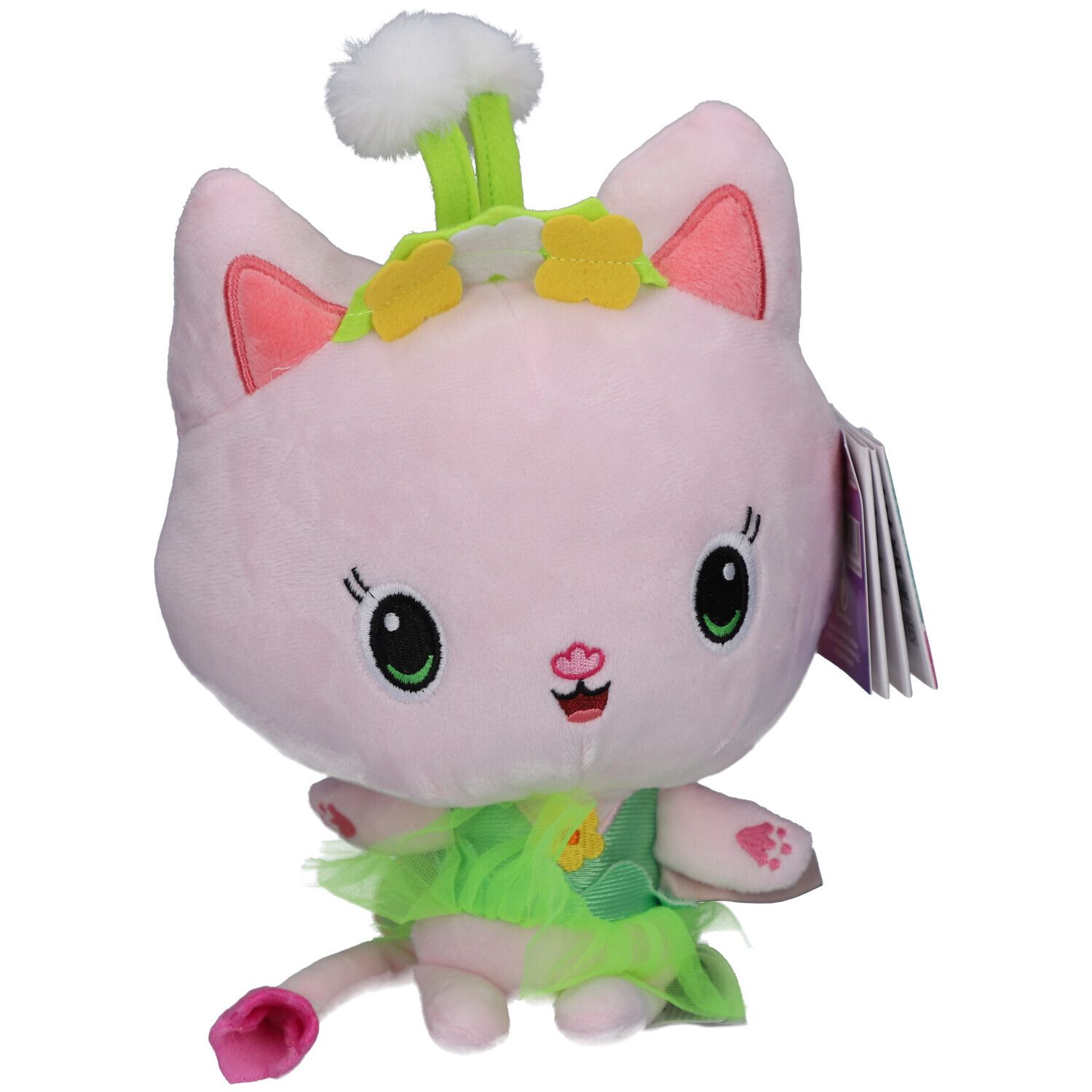 Chat rose en peluche avec détails verts. Il porte une robe verte et des fleurs. Étiquette sur l'oreille.