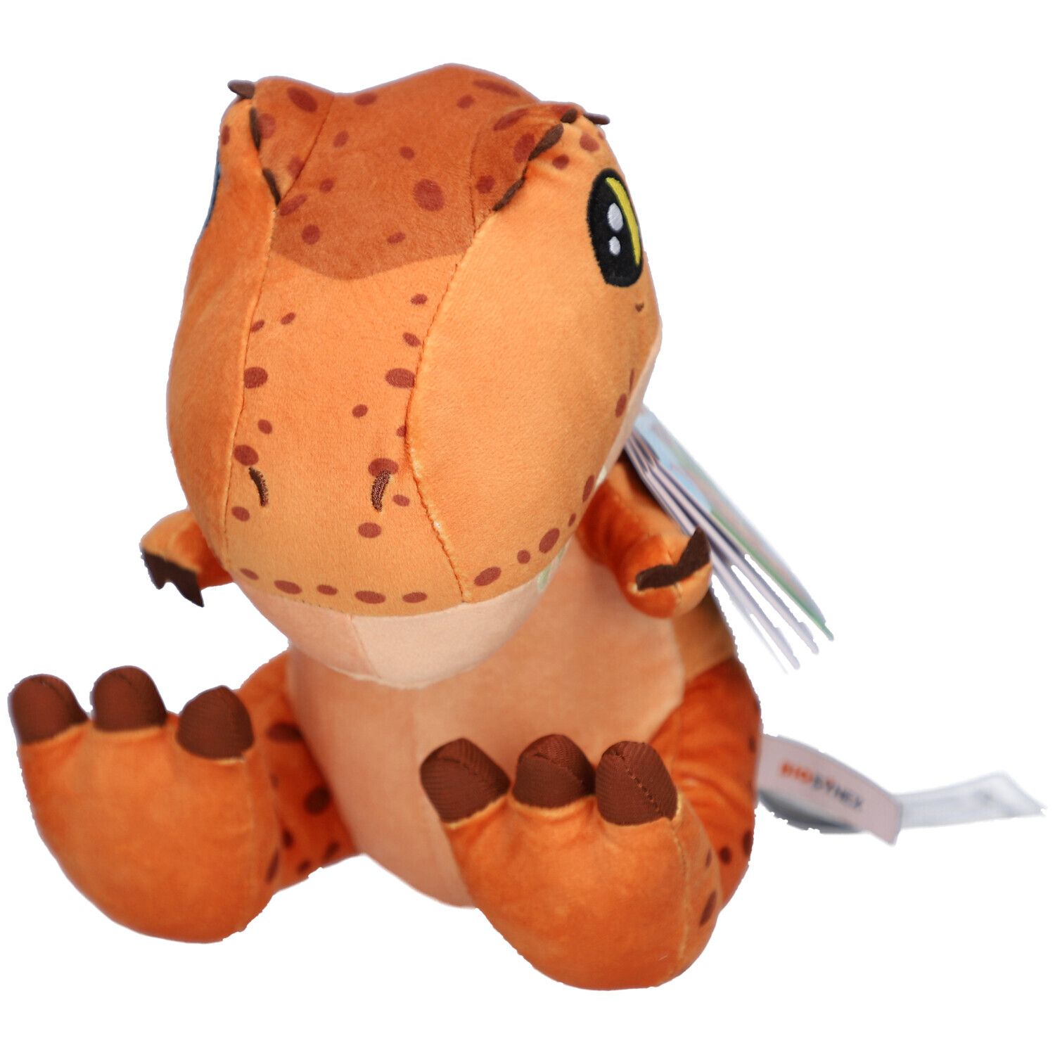Peluche T-Rex orange avec des taches marron et de grands yeux. Une étiquette est attachée au produit.